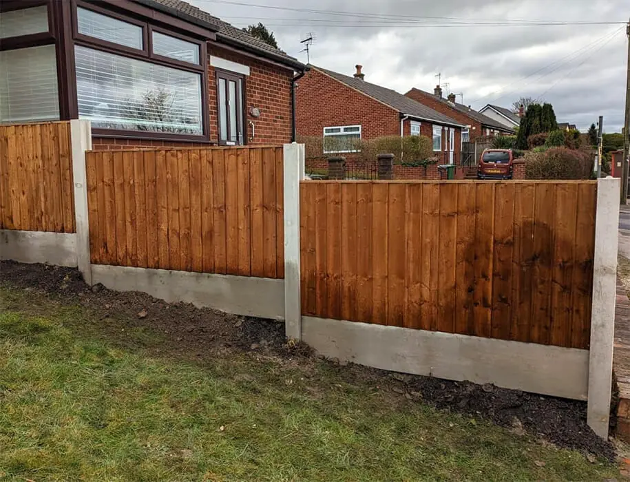 Timber fence panels fitted with concrete posts and gravel boards