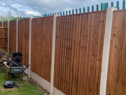 Replacement fence panels fitted between concrete posts